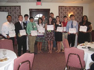 Students accepting scholarship awards at the May ceremony are (front row, l-r) Isuru Wijesundara, Jonathan Hartwick, Michael Ledford, Geneva Runion, Whitney Gustafson, Dana Jo Royal, Michael D'Argenio and Madyson Cooper. In the second row (l-r) are Wayne Lindsay, Col. Charles A. Dunn, USAF, 43rd Mission Support Group Commander, Pope Air Force Base, Richard Ceynar and Ethan LaMaster.